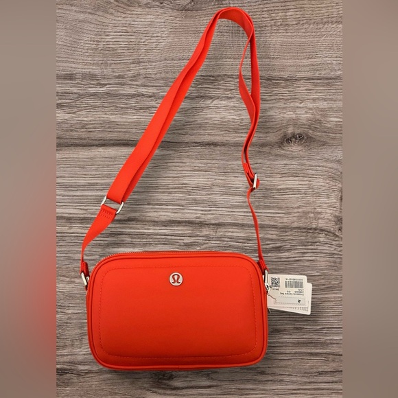 lululemon athletica Handbags - Lululemon NWT Crossbody Camera bag in Light Vapor Red